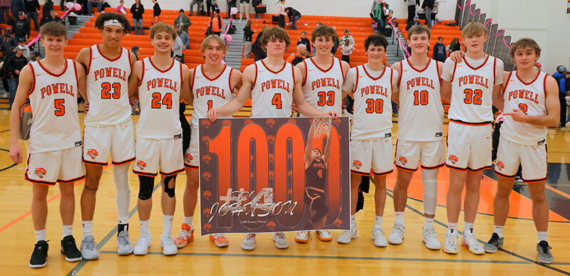 The Powell Panthers pose with Brock Johnson after he shot past 1,000 points on Friday night. From left: Nathan Preator, Alex Jordan, Dawson Griffin, Evan Whitlock, Johnson, Cade Queen, Gunnar Erickson, Trey Stenerson, Jaxon Hancock and Marshall Lewis.