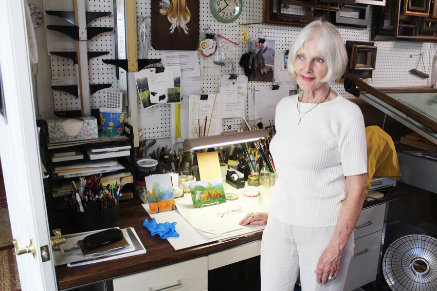 AT HOME IN THE STUDIO, Bonnie Shelton has multiple work areas, including a desk where she paints miniatures.