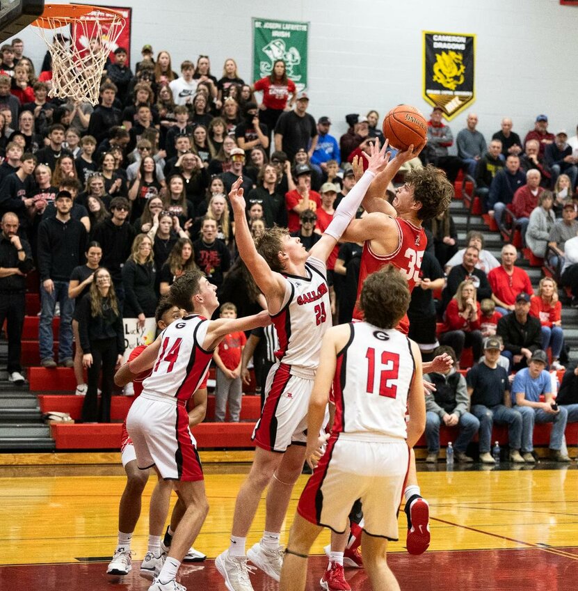 A NIGHT TO REMEMBER, the Lincoln Cardinals punched their ticket to the MSHSAA Class 2 Final Four with a 48-40 win over Gallatin on Friday night. Ben Eckhoff (35) powered up for 2 big points late in the contest.