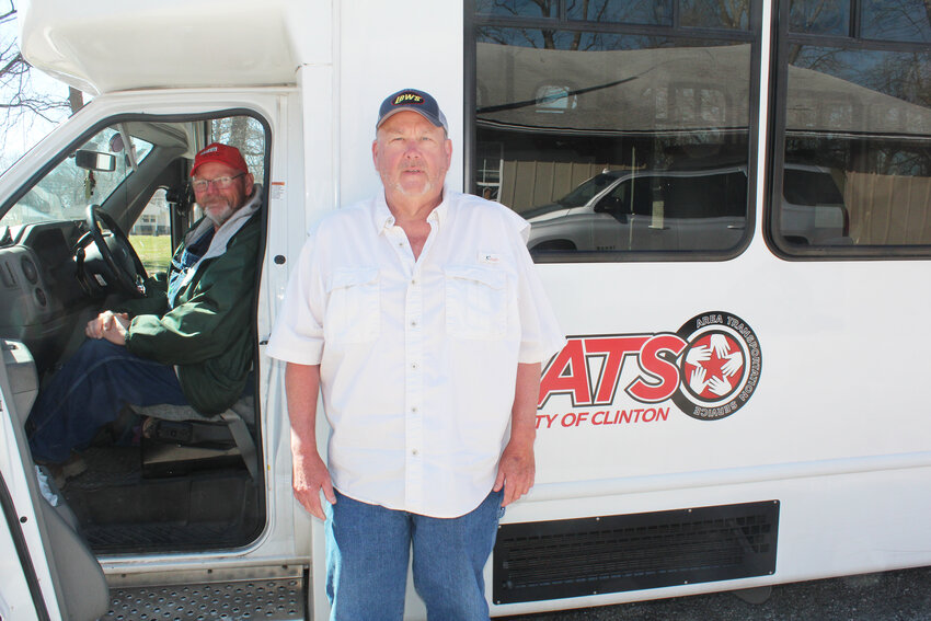 Providing THE FREEDOM TO MOVE about Clinton are Ats Driver David Nichols and Dispatcher Chris Bridges. They keep the local transportation service buses rolling  out of the parking lot of the Boy Scout Building on Augusta, off Price Lane.