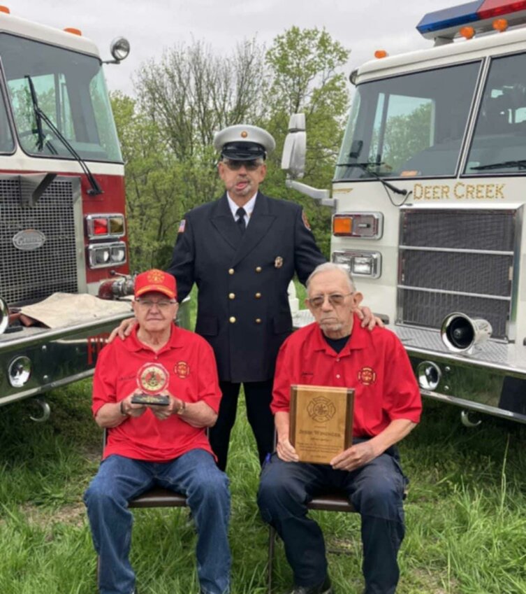 DEER CREEK FIRE PROTECTION DISTRICT LEGENDS, Richard McBride and Jess Wininger were honored for their longtime service and commitment during a recent fundraising dinner. Presenting McBride and Wininger with awards for their achievements was Chief Chad Hammond.