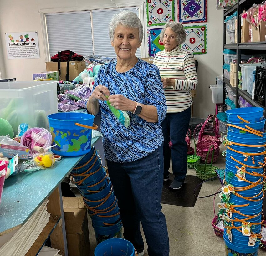 Volunteers Sharon Ogle and Marsha Crutchfield prepare customized Bunny Blessings Baskets for kids in care. Birthday Blessings filled 115 requests from children in need of some Easter cheer. Emotional support is an important part of their mission.