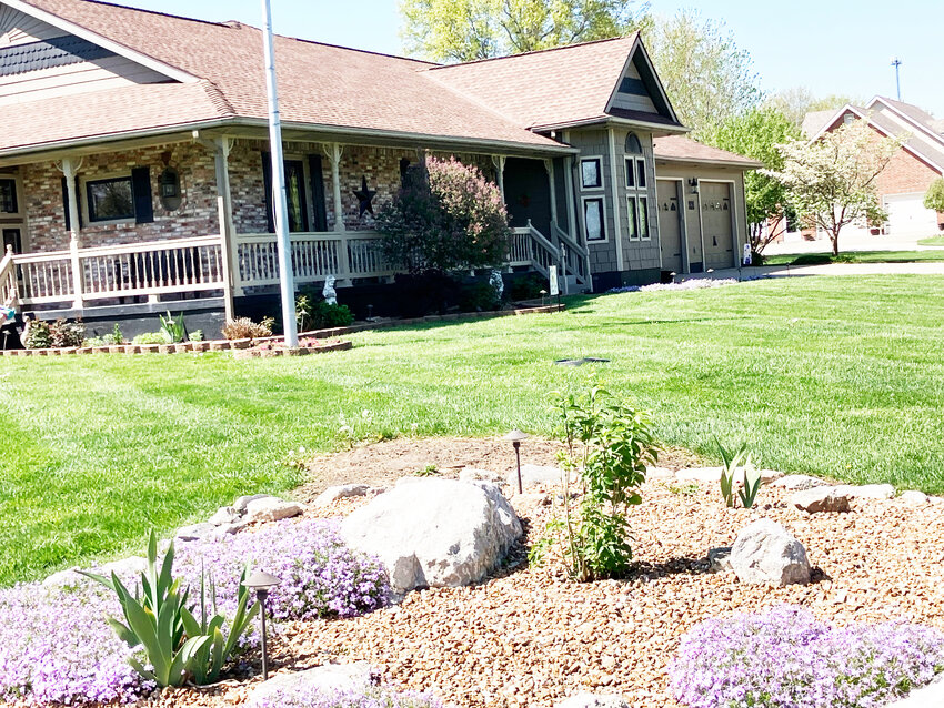 The petal Pushers Garden Club of Windsor has awarded Dave and Karen Neufeld of 101 Highland Dr May “Yard of the Month”. A neatly mowed lush green lawn led to the house where phlox lined the sidewalk. Along the front of the porch were hydengeas, lilac tree, and rose. Diagonal from porch stood the flag pole encircled with pink phlox. To the left of the house is a bleeding heart shaded by a white dogwood. A rock bed with phlox, lilac tree and iris occupy the northeast corner of the yard we urge everyone to maintain a beautiful yard. You may be next. Petal Pushers plant and bake sale starts at 8am-1pm Saturday, May 10th.