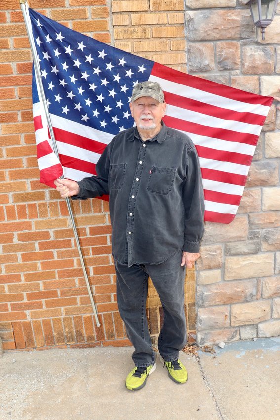 ONE OF MANY local veterans, Bill Hix proudly presented the Star Spangled Banner on Tuesday.