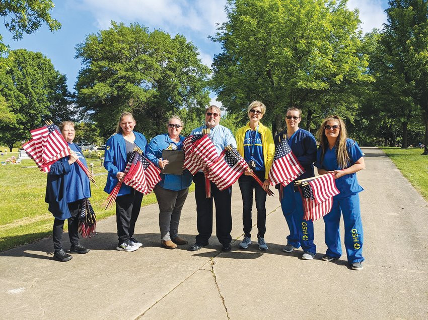 Good Shepard Hospice donated time Friday afternoon to place flags on Veterans graves at Englewood Cemetery.