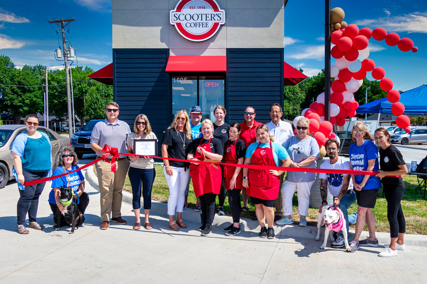 AN OFFICIAL opening took place at Scooters Coffee in Clinton on Friday. Attending the ceremony were Kristina Williams, Laura Himes, Bo (black Dog), Daniel Dody, Amber Hansen, Tracy Bouwens, Pat Nilson, Magan Basic, Hayes Snyder, Katie Hoteling, David Lee, Lindsey Grimes, Jim Raysik, Effie Hubbard, Dan Garnet, Ashley (white Dog), Terri Williams, Rachel Robles.