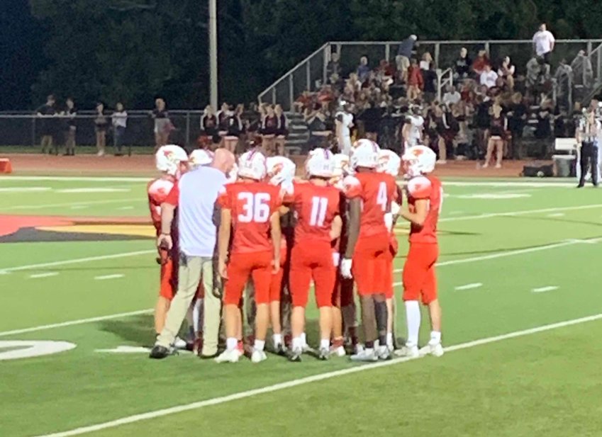 CARDINALS Head Coach Cody Carlson rallies the troops as they prepare to build on a strong first half showing on Friday night in their game versus Odessa.
