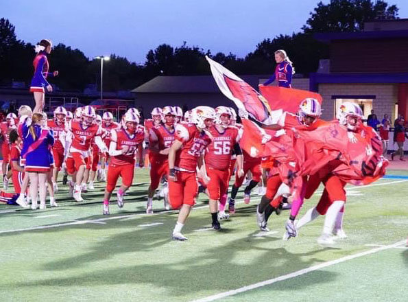 CARDINALS FOOTBALL was led onto their home turf one last time by the Class of 2023 seniors last Friday night when Clinton hosted Warrensburg.  The Cardinals night was dimmed by a 65-7 loss to the visiting Tigers.