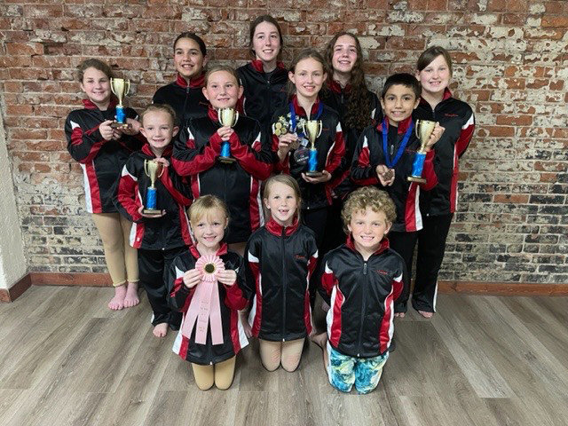 MEMBERS OF BY GRACE performed at their first meet of the 2022 season in Overland Park, Kansas on Sunday.  Members of the squad include, Row 1: Kynna Carney, Keira McConnell, Morgan Miller; Row 2:  Kimber Couts, Kary Hartwick, Haysel Avis, Benjamyn Diaz; Row 3:  Ashlyn McConnell, Jasmyn Diaz, Alexandria Markham, Lana Sockwell, Morghean.