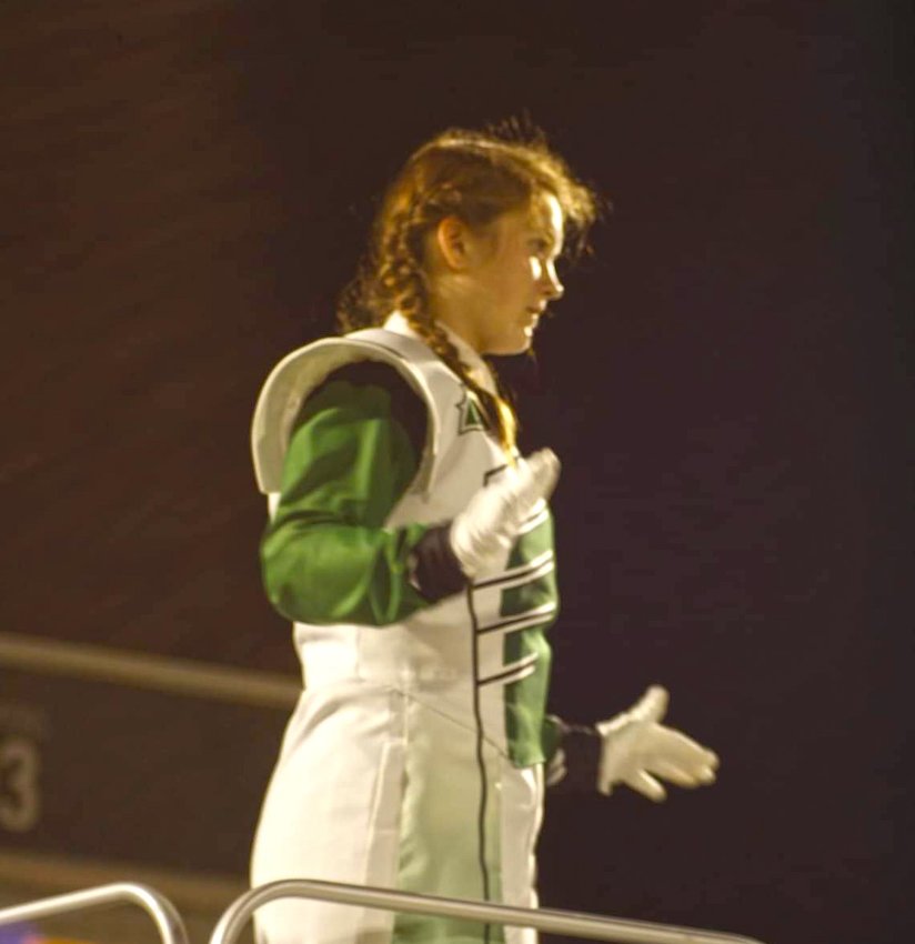 WHS DRUM MAJOR Alyson Alcantara directs the Pride of Warsaw Band at the Warsaw Marching Festival this past Saturday. It was the first time an event of it's type has ever been held at the school.