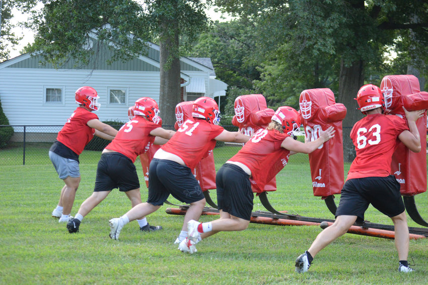 DON'T GET IN OUR WAY! The Lincoln line will be a huge key to the upcoming season. The boys worked on the tackling dummies at 6:30am on Monday morning, the first official day of practice.