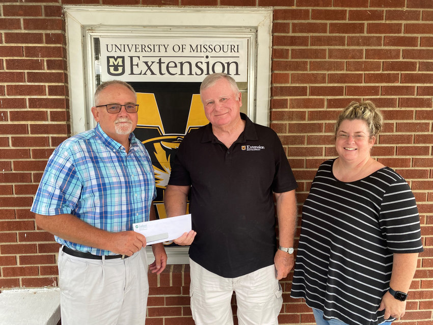 BENTON COUNTY was 1 of only 3 University of Missouri Extension offices to receive a SWEC grant in the amount of $6,600.  Those present for the check presentation were (L to R): Ted Zeugin, Southwest Electric Cooperative; Tom Hare and Amie Breshears.