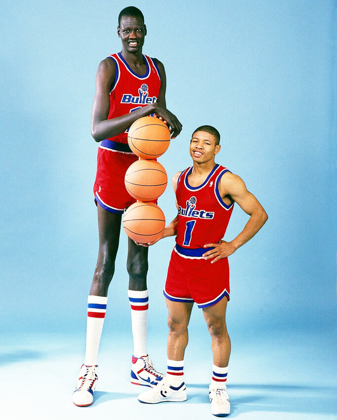 THE BIG AND SMALL OF IT ALL, Tyrone (Muggsy) Bogues, at 5'3&quot; and Manute Bol, at 7'6&quot;, were once the shortest and tallest players in the league and teammates on the Washington Bullets (now the Wizards).