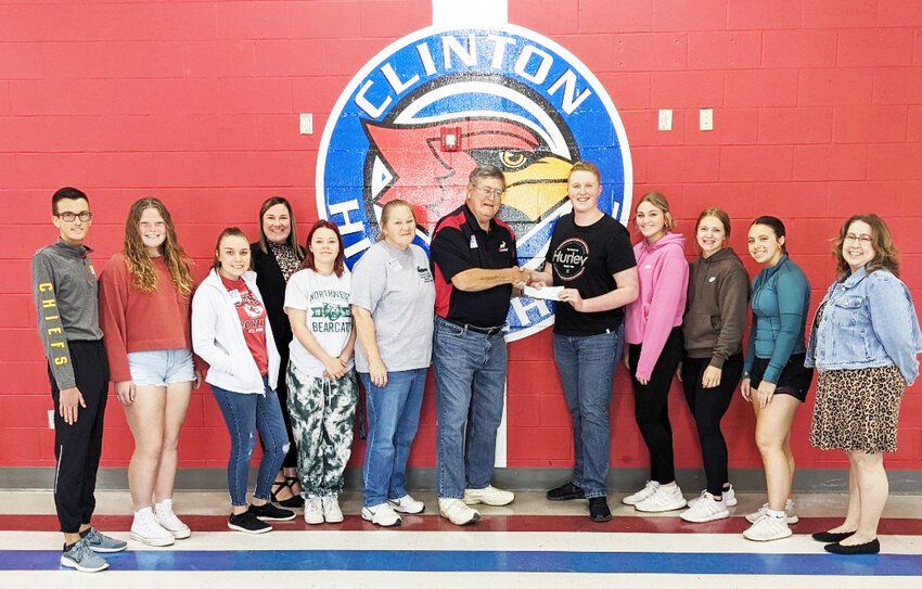 Members of the Truman Lake Moose Lodge make a donation to the Clinton High School Junior Class Student Council to benefit Project Prom.