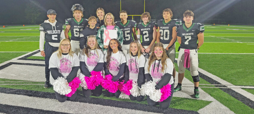 SURVIVING AND THRIVING, Heather Bagley was diagnosed with breast cancer in 2022.  The Warsaw resident finished treatment last spring and recently attended a WHS football game where players, including her sons, Kendall and Easton, cheerleaders and others recognized Breast Cancer Awareness Month.