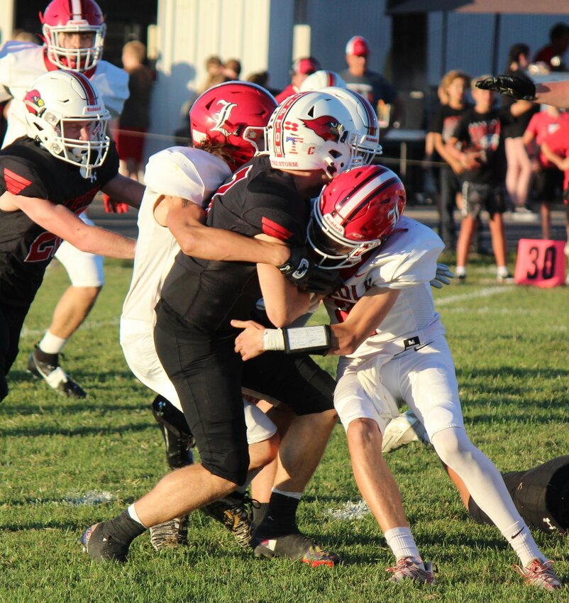 NOT THIS TIME, the Cardinals' Larry Roberts and Riley Sanders tackled a Tipton runner on Friday night. Lincoln was mauled, 60-14.