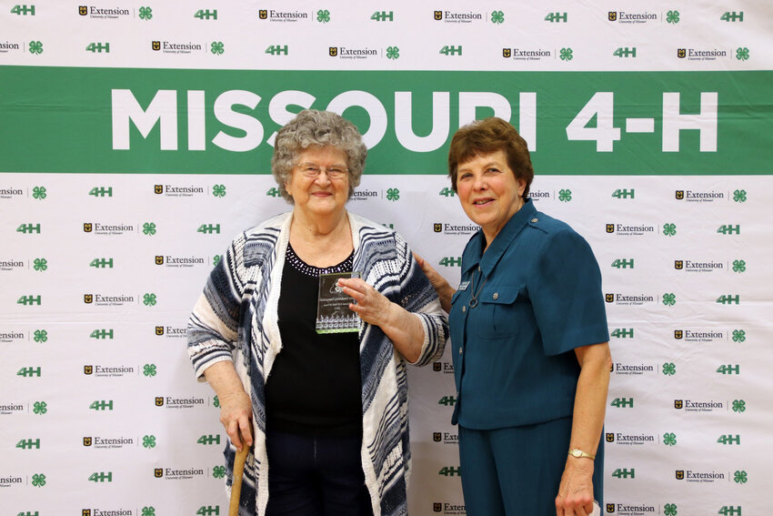 MAKING HER MARK on the 4-H community, Elvera Schnakenberg Zimmerschied was inducted into the Missouri 4-H Hall of Fame at a ceremony held during this year's Missouri State Fair.  Missouri 4-H Foundation Trustee Marla Tobin presented the ward to Zimmerschied.