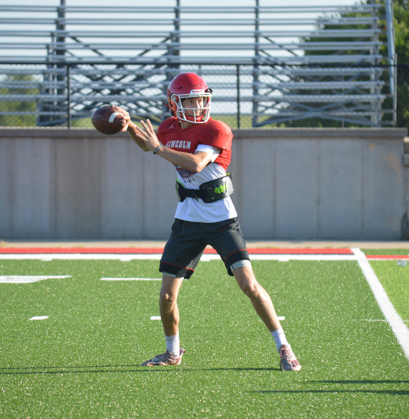 SOPHOMORE SENSATION Riley Sanders has patiently waited his turn to be under center, but it is now up to him to help lead Lincoln football.