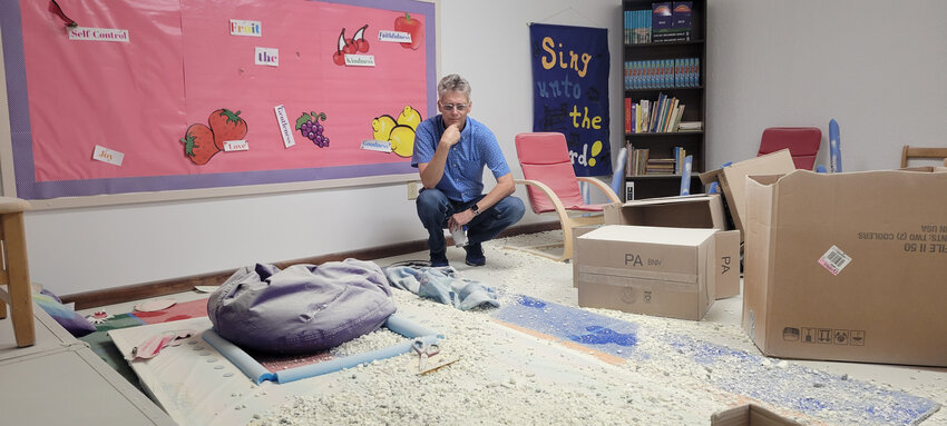 PREYING ON THE FAITHFUL, vandals and thieves have hit the First United Methodist Church in Warsaw twice.   Pastor Loren Whetsell surveyed part of the damage on Tuesday morning.