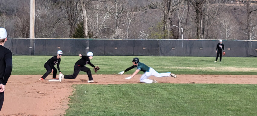 SHOWING HIS WHEELS, Wildcats senior Gage Whitaker stole second base in Warsaw's 5-2 Ozark Highlands Conference win over Butler at home on Monday night.