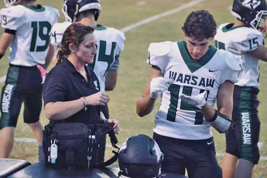 HELPING STUDENTS SUCCEED AND KEEPING THEM SAFE, Warsaw High School Athletic Trainer Lisha Douglas brings life saving skills and support to each game she attends.