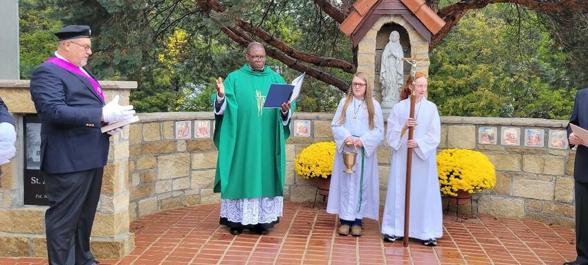 BRINGING A REFLECTIVE TRANQUIL space, St. Ann Catholic Church held a dedication for a new memorial prayer garden on Sunday morning.  Fr. Ben Nwosu conducted the ceremony with Gracelyn Pritchard and Michelle Ricke.