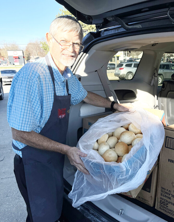 A FORCE FOR GOOD, Dietz Family Buffet Proprietor Mark Dietz and his wife Becky donated 1,200 rolls for the annual countywide Thanksgiving.