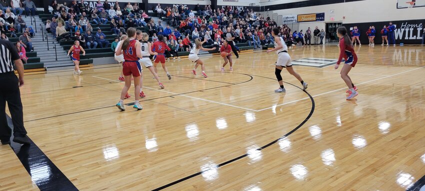 THE LADY CARDS Skyte Wilson lined up a shot from deep in Saturday night's 62-31 championship loss to Skyline at the 36th Annual Warsaw Invitational Girls Basketball Tournament.