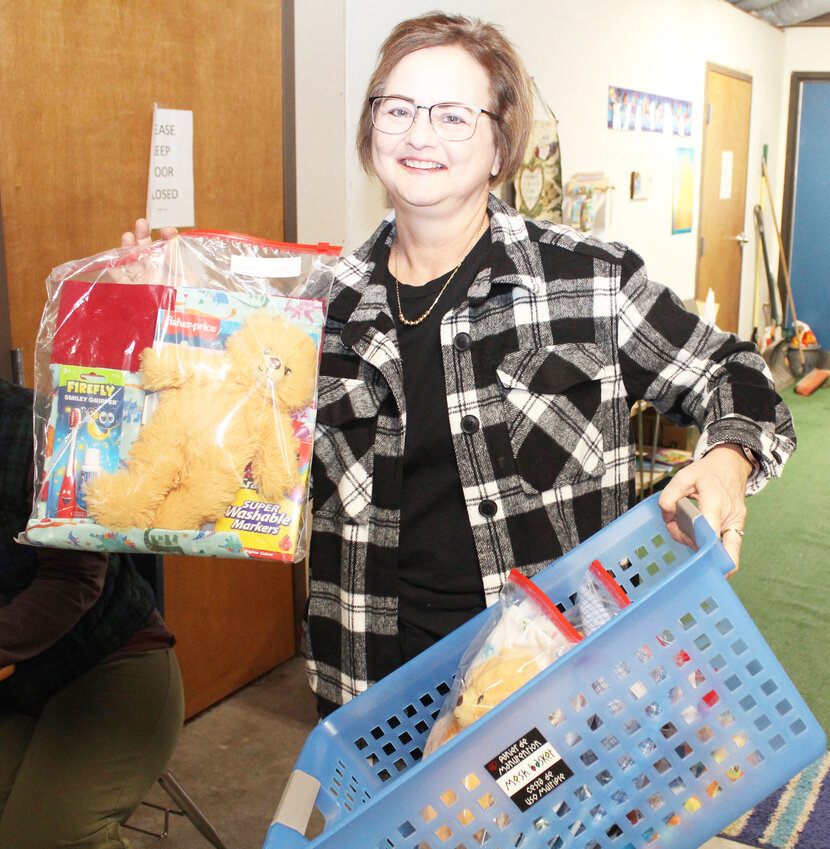 GROWING FOR A GOOD CAUSE, Tammy Woirhaye&rsquo;s Foster Closet was housed in her basement dubbed the &ldquo;Woirhaye Wal-Mart&rdquo; before moving to State Fair Community College. Woirhaye showed Care Bags made and donated by women at Trinity Lutheran Church.