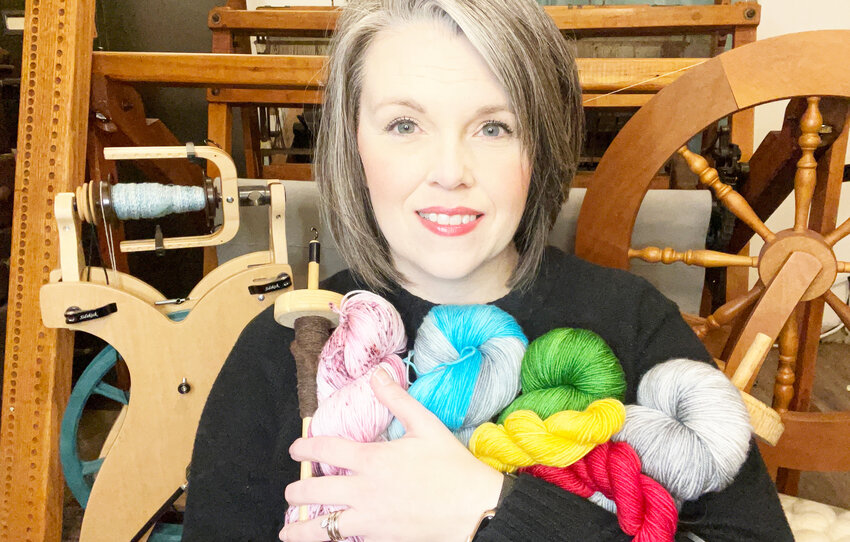 A PASSION FOR FIBER, Dusty Mills has a hand in a variety of arts, including dying, weaving and spinning wool that she sells through her online business, Muddy Crow.