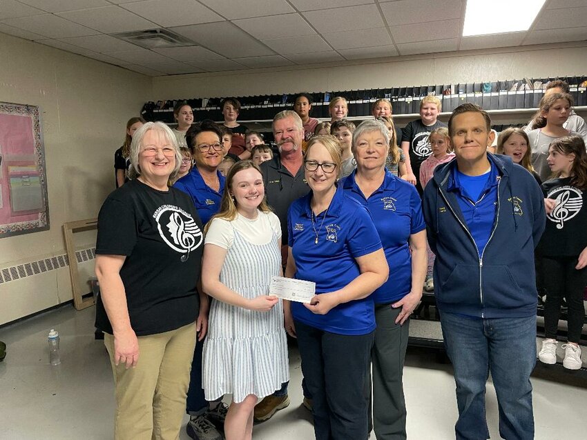 R-IX CHOIR STUDENTS are set to compete at Music In The Park Festival that will be held in Branson on April 27. Their trip has been underwritten by donations, including one from the Benton County Elks. Attending a check presentation at R-IX North were, front row: Mrs. Rhonda Applegate, Brookelynn White, Stephanie Anderson; and back row: Genia Townsend, Bob Waters, Marilee Carman and Brett Powell.