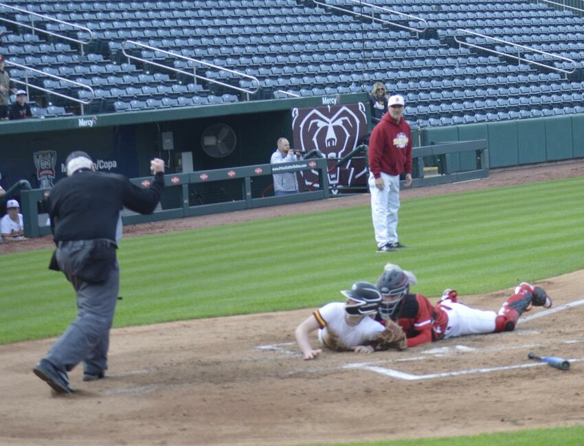HE IS OUT! Lincoln's Zaden Cole blocked the plate and tagged out Kaden Coble in the third inning of Lincoln's game with Mansfield at Hammons Field in Springfield on Friday night. Lincoln lost 5-4 in eight innings.
