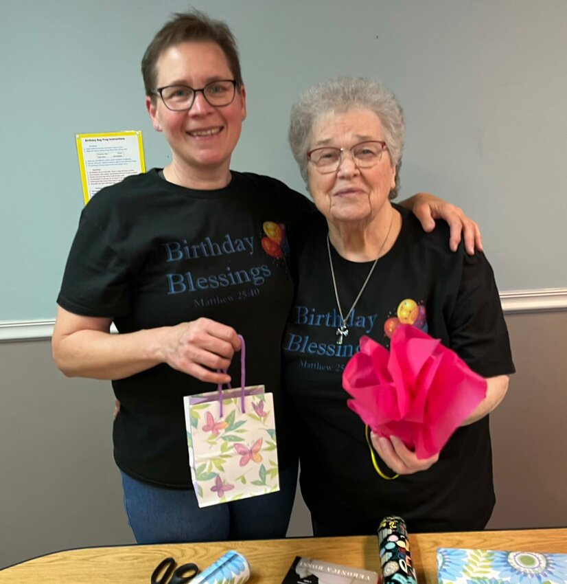 Shannon VonAllmen, Executive Director of Birthday Blessings, and volunteer Jackie Kelly wrap birthday gifts for kids in foster care. Last year the nonprofit filled more than 1750 service requests from Missouri kids experiencing foster care.