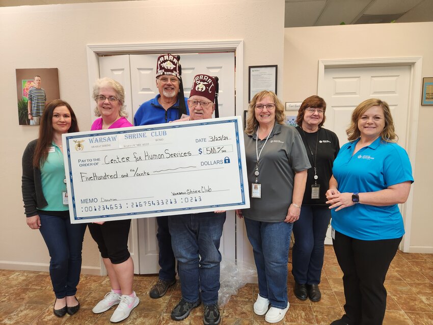 WARSAW SHRINE CLUB recently presented a check for $500.00  to the Center for Human Services in Warsaw to aide in the fine work they do. There for the presentation were: Lindsay McDornall-CHS, Lisa Hsgness-CHS, Steve Elliott-Warsaw Shrine Club, John Mackey-Warsaw Shrine Club, Tracey Roberts-CHS, Cathy Parker-CHS and Chanish Lambert-CHS.