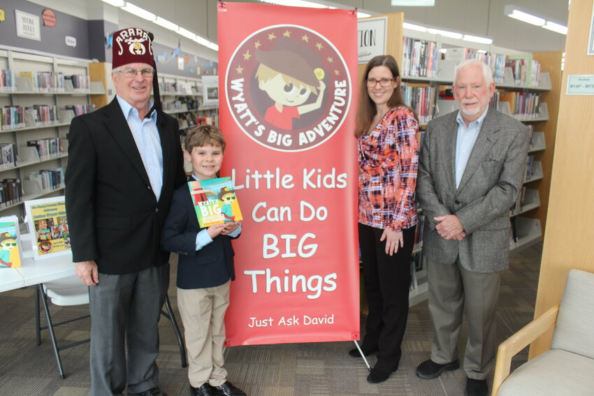 A REMARKABLE WORK THAT’S GONE GLOBAL, Wyatt Shield penned a book at age 5. Shield visited Clinton and was accompanied by his grandfather Kyle Rhorer and mother Amanda Shield. The trio met with Fred Bunch at the Henry County Library during a book reading by Shield.