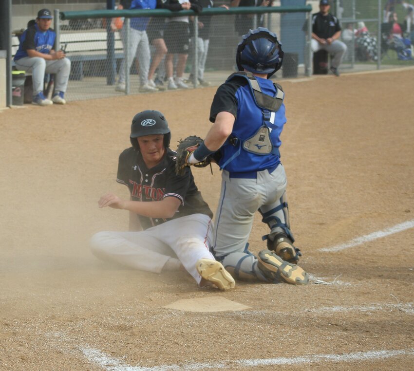 NOT EVEN CLOSE, Cole Camp catcher Grady Strathman tags out Tipton's runner and looks at the runner at third  on Monday in Cole Camp. Tipton won 6-2 in the Kaysinger  Conference tournament semifinal.