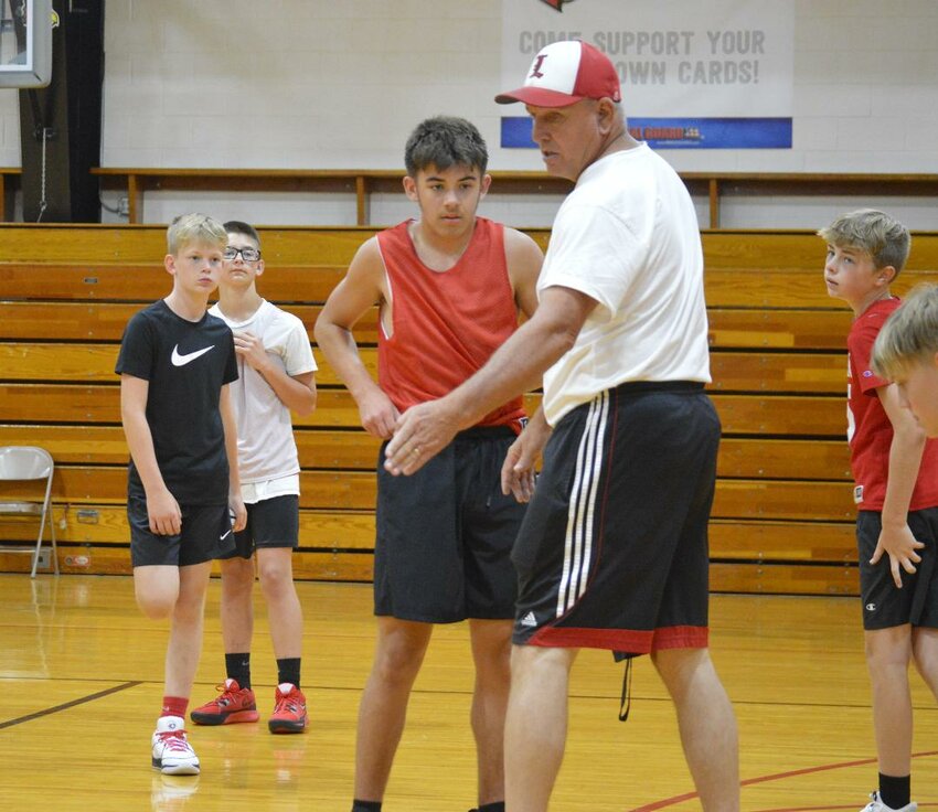 WHAT IN THE WORLD IS A SCREEN? On the last day of summer practices, Lincoln junior high coach Will Lynde taught the lost art of setting a screen. Hopefully, they will pick up a basketball on their own over the summer months. The middle schoolers showed promise but will still need to improve to compete in the ten team Kaysinger Conference.