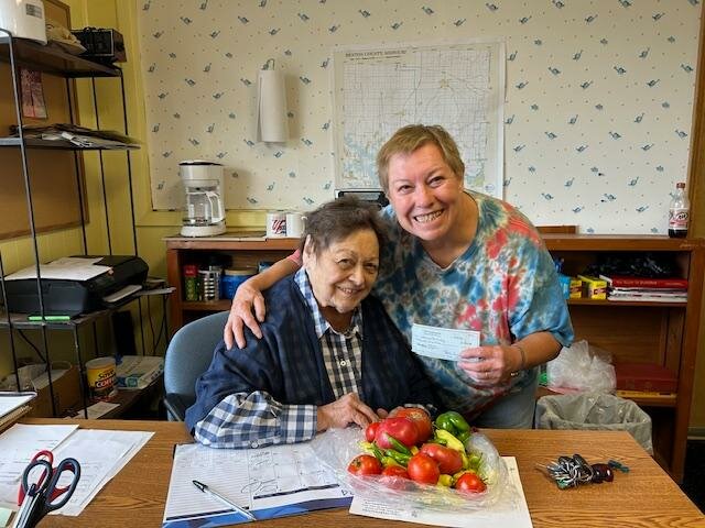 UNITY OF THE LAKES of Warsaw donated a check, fresh garden vegetables and several boxes of non-perishable food to the Cole Camp Food Pantry. Volunteer Sharon Foraker accepted a check from Jean Eckstein of the church on Friday, August 23. The Cole Camp Food Pantry is located across the street from the Benton County R-1 School and is a great benefit to the community.