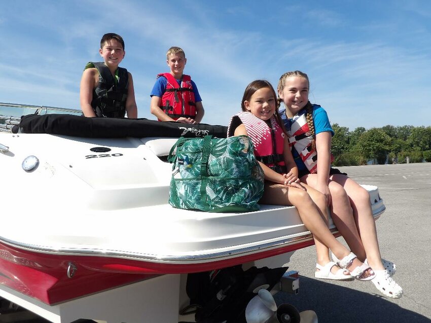 LABOR DAY BOATERS TOOK TO THE WATER during the long holiday weekend and the twin-lakes area was jam packed. Bennett Burke, Easton Tilden, Cora Burke and Eisley Tilden prepared to launch at Drake Harbor on Monday morning.