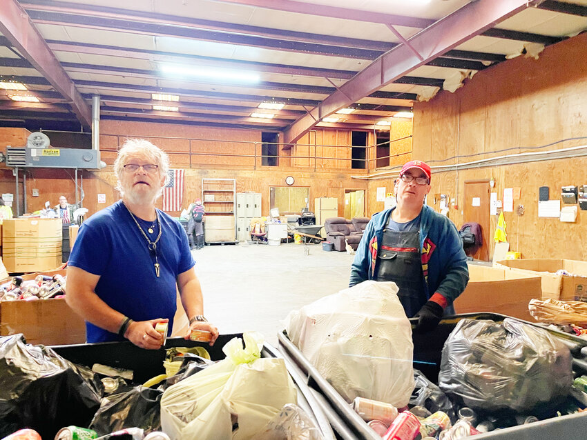 NO LONGER ACCEPTING PLASTIC and only shredded paper due to recent equipment problems, Henry County Industries in Clinton is doing their best to continue their recycling mission. Daniel Chies and Stephen Douglas sorted items on Tuesday.