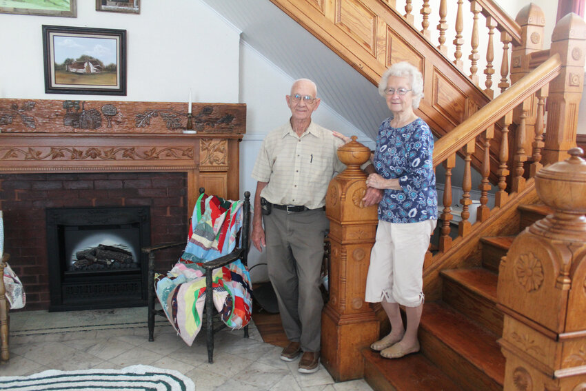 FROM HOTEL TO HOSPITAL TO FAMILY HOME, Leroy and Dorotha Swopes showcase the grand staircase of the former Durley Hotel lobby in Appleton City. The couple bought and restored the structure.