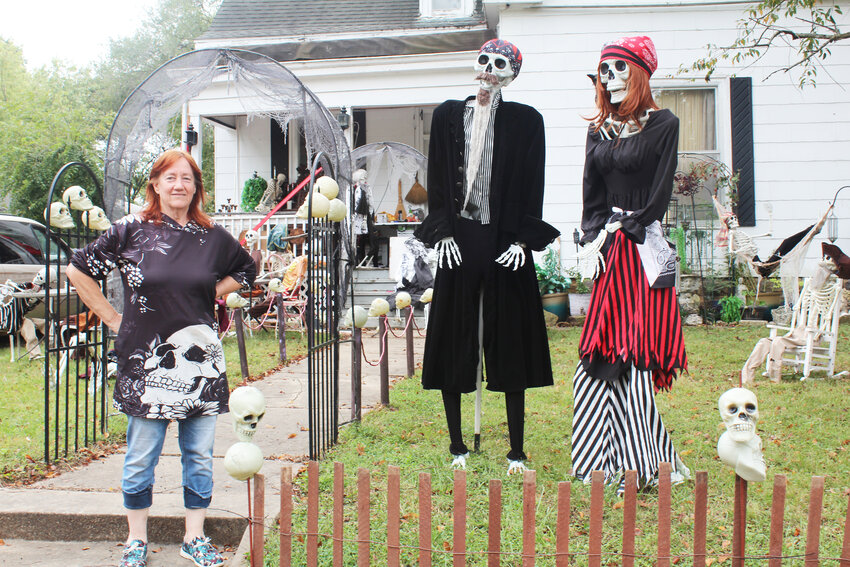 CLINTON’S FAMED SKELETON LADY Tami Jones is working on the details of a pirate ship in her Halloween themed front yard. Jones will take part in a Home Tour and Scavenger Hunt on October 26.