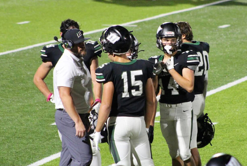 THE DEFENSE OF THE WILDCATS had Eldorado Springs on tilt from their first possession. Warsaw held the Bulldogs to just 1 first down in the game and a net yardage total of -16. Coach Wisdom met with his linebacker corps during a timeout in Friday's lopsided 61-0 win at home.