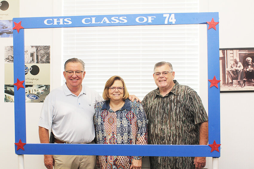 AND MANY MORE, the CHS Class of 1974 will memorialize 50 years since their graduation as part of this week’s Homecoming festivities. Gene Collier (right) made the class reunion photo frame that folks will use at this weekend’s get-together. Gregg Smith and Mary Lyn Hunter Collier are members of the class.