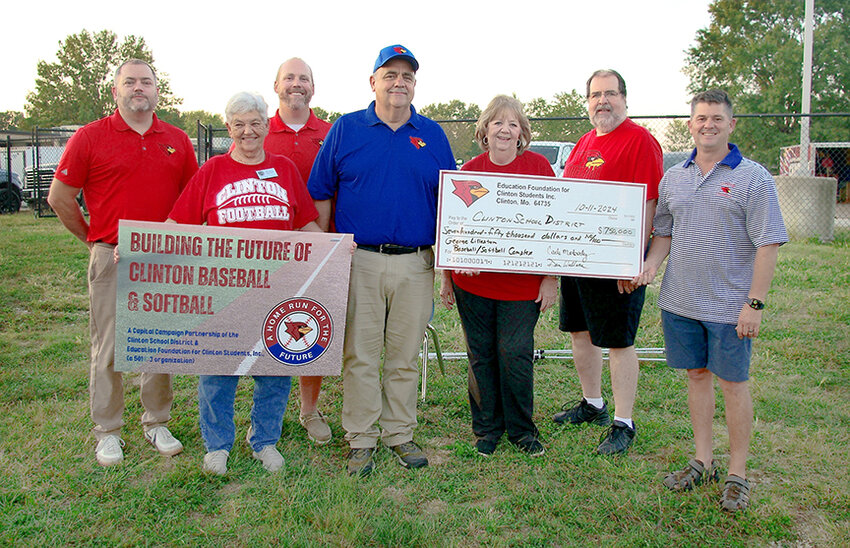 CLINTON HIGH SCHOOL got a big boost with a gift from the foundation created by the late George Lilleston for brand new baseball and softball fields. Marking the occasion were Ryan Parks, Marilyn Parratt, Cody Westendorff, Dan Brungardt, Mayor Carla Moberly, Dan Wallace and Eric Mitchell.