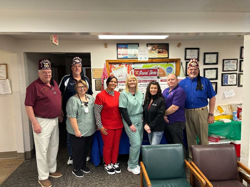 A WINNING COMBINATION of members from the Shriners and Benton County Health Department conducted a screening clinic for children on Saturday. Those involved in a busy day of volunteering included (L to R): Chuck Allcorn, John Schlechter, Dr. Amber Campbell, Shiree Sherrill, Kelli Daleske, Heather Greene, Jon Schmidt and Steve Elliott; not pictured: Leroy Graham.