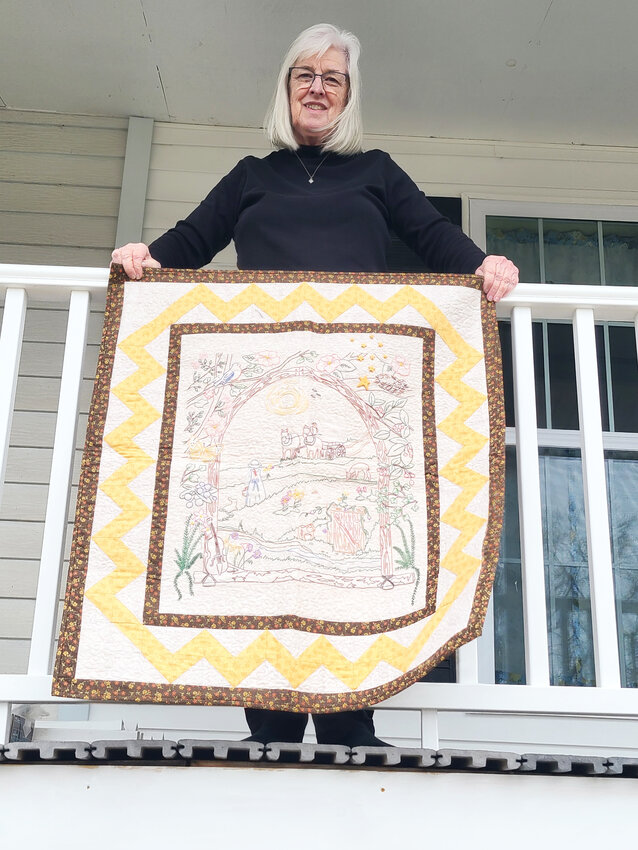 ARTISTRY ON DISPLAY, Judy Wampler’s work “On the Banks of Plum Creek” is an embroidered quilt showing Pa stopping to his wagon to wave to Laura and Mary.