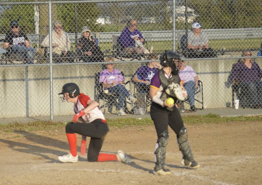 IN A FLARE FOR THE DRAMATIC, Molly Strozewski scores the winning run on a walk-off single by Alyssa Mellen in a 4-3 Lady Cardinals victory over Green Ridge at home on Thursday.