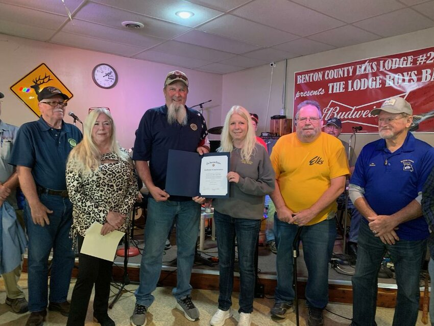 THE ELKS have a saying "As long as there are Veterans the Elks will never forget them." Officers from the Elks and the American Legion gathered to present and receive a check for the Veterans Crisis Fund that assists Veterans and widows of Veterans with various needs. This was made possible by a Freedom Grant from The Elks National Veterans Service Commission. Above, American Legion Commander Barry White presented a Certificate of Appreciation to Elks Exalted Ruler Kathy Rothwell for the continued support from the Elks Lodge.