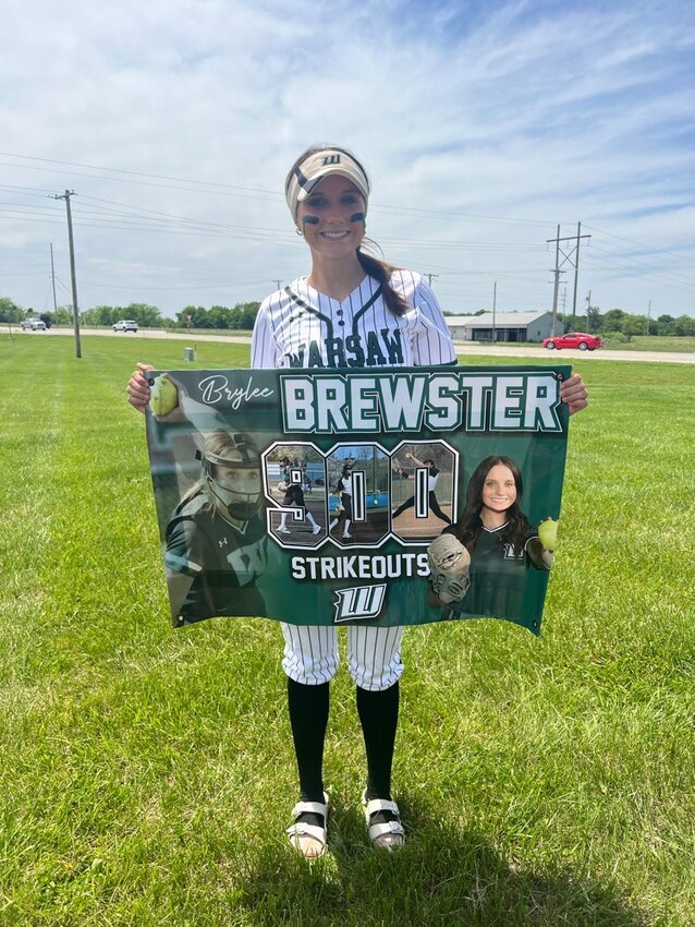 MARKING A MILESTONE, the Ladycats Brylee Brewster rung up the 900th strikeout of her career for Warsaw in Saturday's district win over Pleasant Hope.